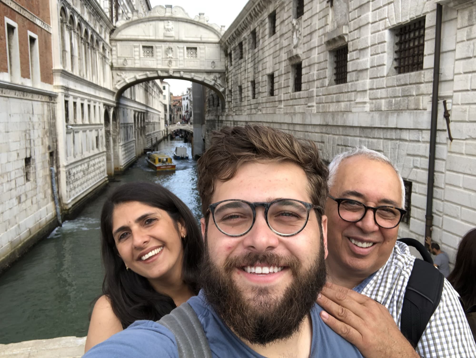 Tiago with his parents in Venice, the Bridge of Sighs behind