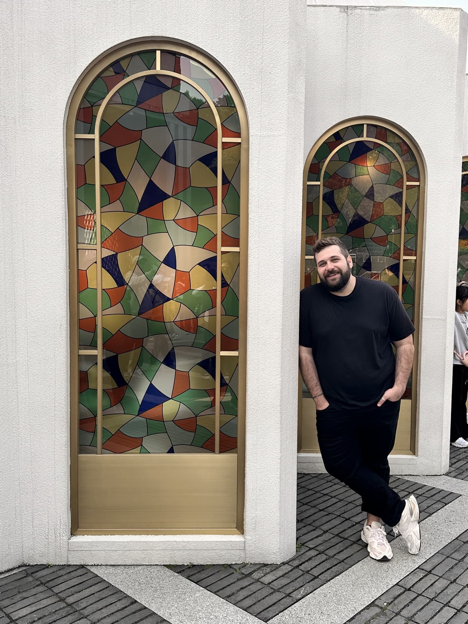 Tiago in front of stained glass
