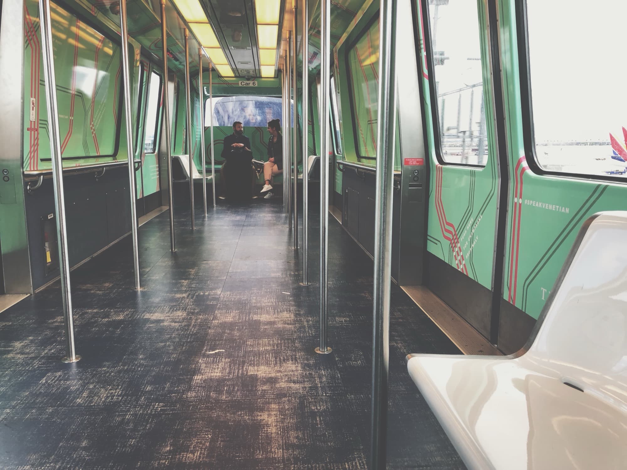 Empty green metro train